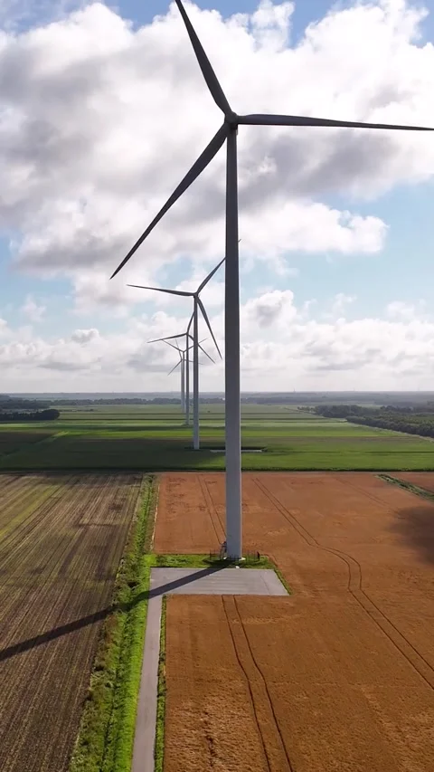 Aerial view of wind turbines generating renewable energy Stock Footage 327111392