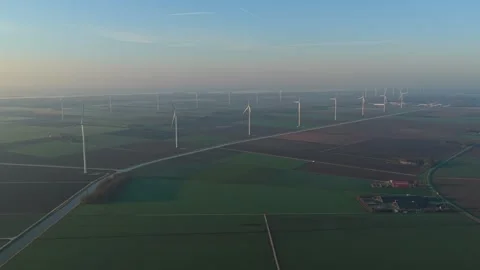 Aerial view of wind turbines generating sustainable energy in the netherlands Stockbeeldmateriaal 332680735