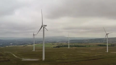 Aerial view of wind turbines generating renewable energy in countryside lan.. Stock Footage 337813740