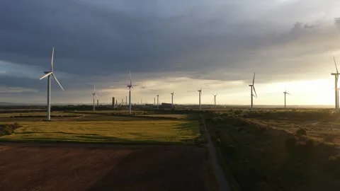 Aerial view of wind turbines generating renewable energy at sunset 스톡 동영상 342611053