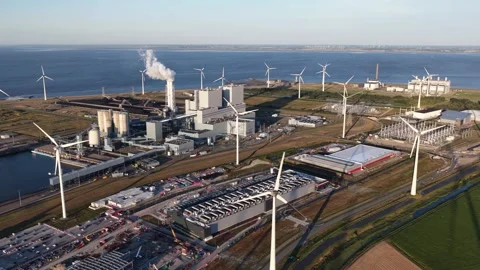 Aerial view of wind turbines generating renewable energy at eemshaven port Stock Footage 344768417