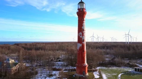 Aerial view of Wind turbines, lighthouse at sunset. Green clean energy. Stock Footage 101077398