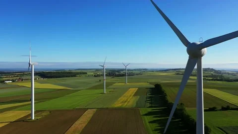 Aerial view of wind turbines over landscape Video stock 133553771