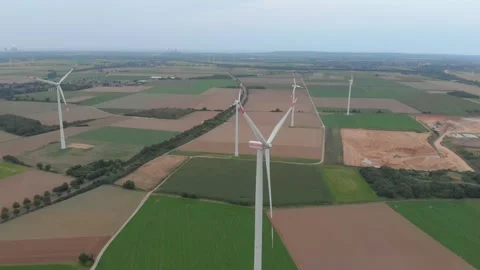 Aerial View Of Wind Turbines Over Fields With Roads And Clouds. Video stock 299051653