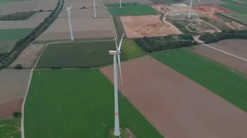 Aerial View Of Wind Turbines Over Fields With Roads And Clouds. Video stock 299055002