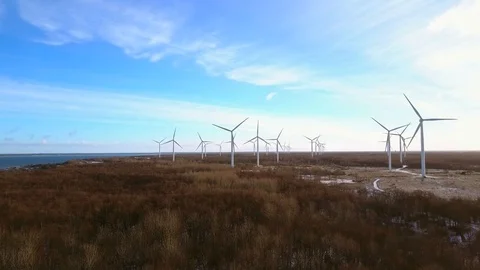 Aerial view of Wind turbines at sunset. Green clean renewable energy production Stock Footage 101077464
