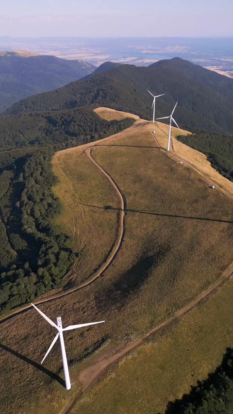 Aerial View of Wind Turbines Windmill Farm on Mountain Ridge at Sunset Stock-Footage 343511232