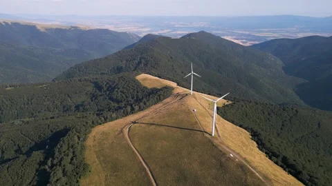 Aerial View of Wind Turbines Windmill Farm on Mountain Ridge at Sunset Stock-Footage 343511365