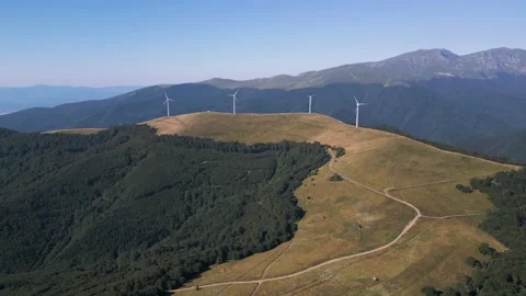 Aerial View of Wind Turbines Windmill Farm on Mountain Ridge at Sunset Video stock 343511475
