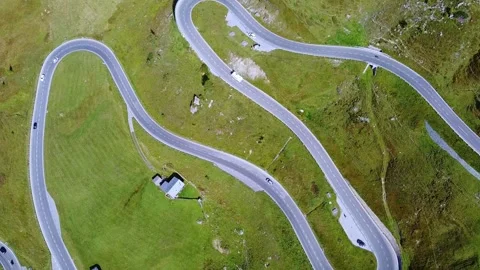 Aerial View of Winding Alpine Roads Traversing Austrian Mountain Landscape Video stock 342336437