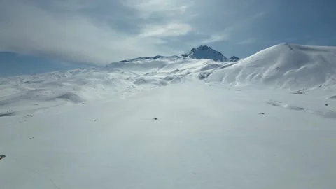 Aerial View of Winding Highway Through Snow-Covered Mountains 库存影片 330168051