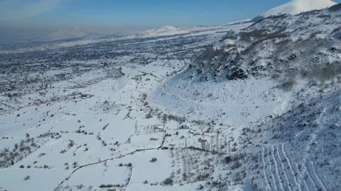 Aerial View of Winding Highway Through Snow-Covered Mountains 库存影片 330168081