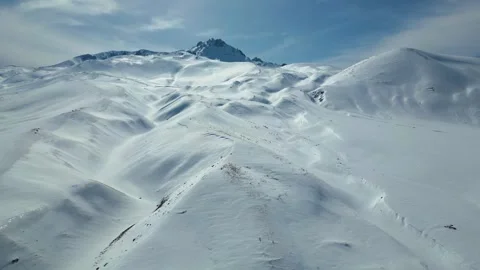 Aerial View of Winding Highway Through Snow-Covered Mountains 库存影片 330168857