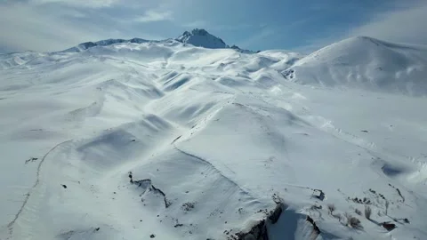 Aerial View of Winding Highway Through Snow-Covered Mountains 库存影片 330168935
