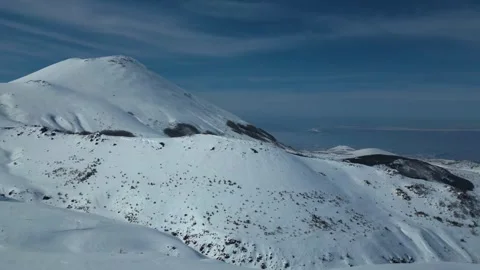 Aerial View of Winding Highway Through Snow-Covered Mountains 库存影片 330169546