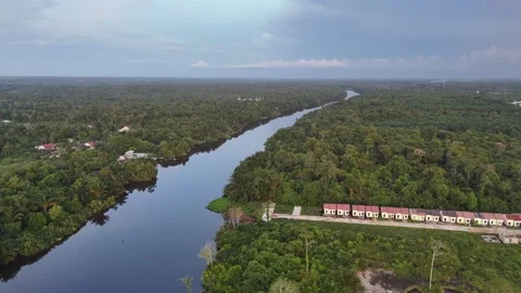 Aerial View of Winding Kapuas River with Rural Roads and Houses Stock Footage 334210941