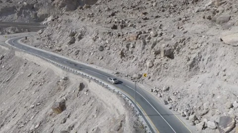 Aerial view of a winding mountain road in Pakistan, highlighting the rugged Stock Footage 314458149