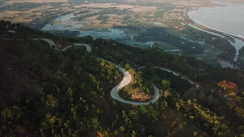 Aerial View of Winding Mountain Road and Coastal Plain in Ciletuh Geopark Video stock 344623607