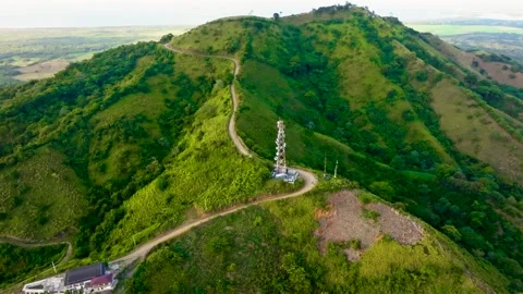 Aerial view of a winding mountain road in the Dominican Republic - drone video. Видео 344921883