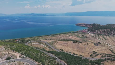 Aerial view of the winding mountain road along the Albanian side of Lake Ohrid Stock Footage 345888957