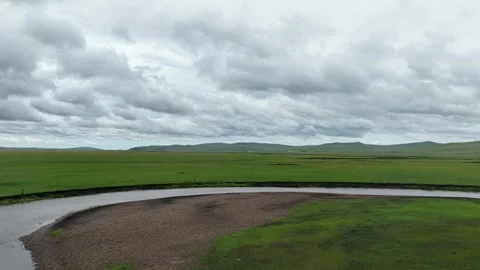 Aerial view of winding river across Chen Barag grassland Stock Footage 340217292