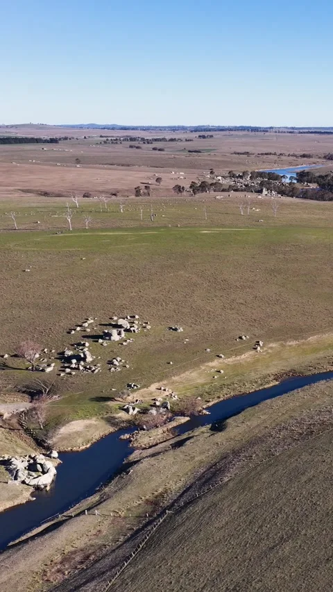 Aerial View of Winding River and Rolling Hills in Uralla Stock Footage 341069497