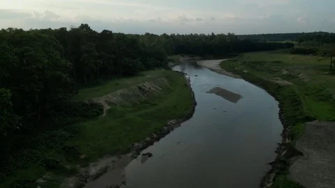 Aerial View of Winding River and Green Forest in Rural Countryside Stock Footage 341828536