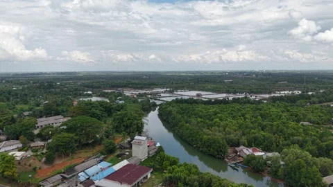 An aerial view of a winding river with blue water, caused by mixing with se.. Vidéo 344861023