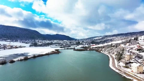 Aerial view of winding River Doubs in snowy landscape, France. Stock Footage 312757179
