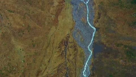 Aerial view of a winding river in a mountain valley Stock Footage 320852710