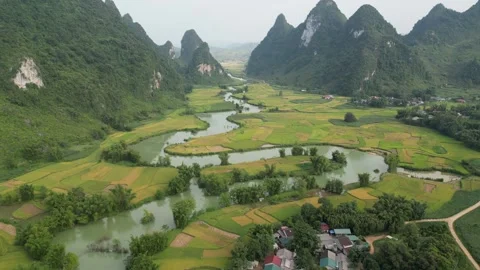 Aerial View of Winding River Through Rice Terraces and Karst Mountains in Cao Stock Footage 334620692