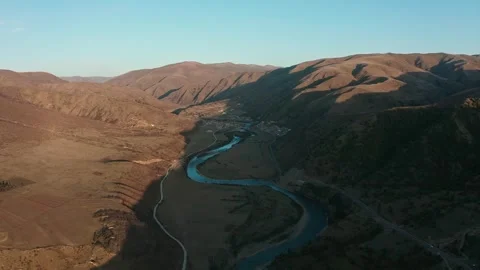 Aerial View of Winding River Through Mountain Valley at Dawn in Sichuan China Stock Footage 342090930
