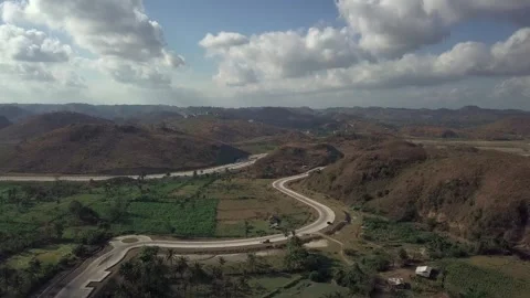Aerial View of Winding Road and Hills at Bypass Mandalika, Lombok Stock Footage 345207585
