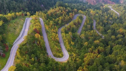 Aerial view of winding road on mountain in Autumn Stock Footage 122013555
