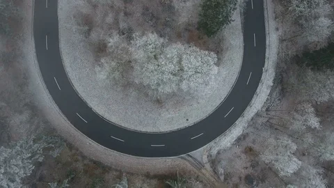 Aerial view of a winding road through the forest Stockbeeldmateriaal 71473250