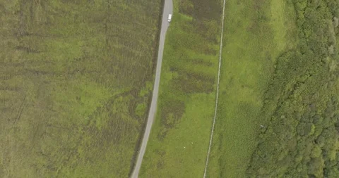 Aerial view of winding road through green countryside, United Kingdom. Stock Footage 284845842