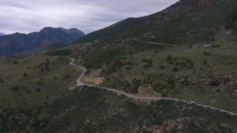 Aerial view of winding road through majestic mountains in Borsh, Vlore, Albania. Stock Footage 297296974