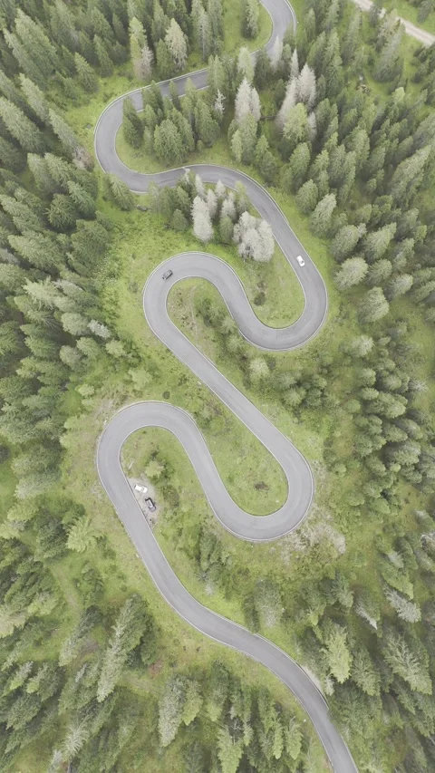 Aerial view of winding road through mountain pass, Italy. Stock Footage 300992213