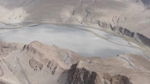 Aerial view of a winding road through a desert landscape in Pakistan 스톡 동영상 314455265