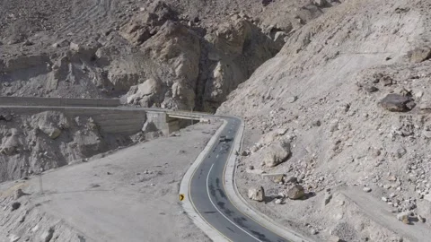 Aerial view of a winding road through the rugged mountains of Pakistan 스톡 동영상 314455887