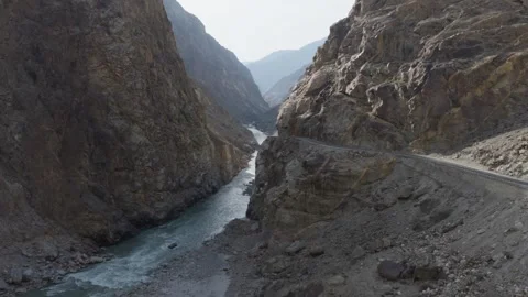 Aerial view of a winding road through a dramatic canyon in Pakistan 스톡 동영상 314455959