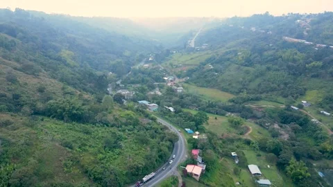 Aerial view of winding road through green valley near Popayan Video stock 331254872