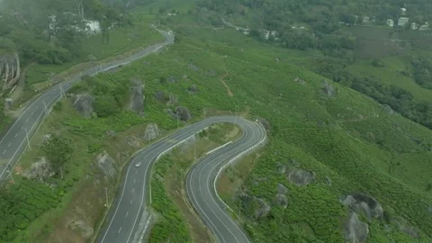 Aerial view of winding road through tea plantations in Munnar Kerala India Stock Footage 333161344