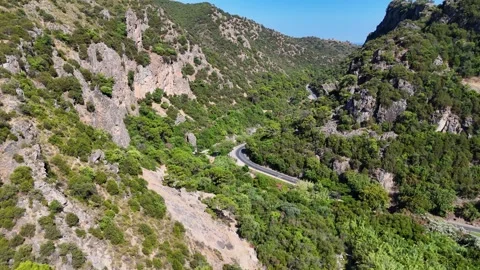 Aerial view of winding road through rocky mountain gorge, Benahavis, Spain Stock Footage 339304823