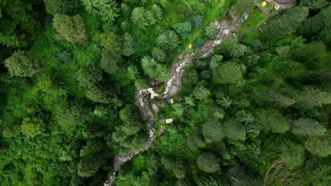 Aerial view of a winding stream and camping tents in Sethan, India. Stock Footage 340186157