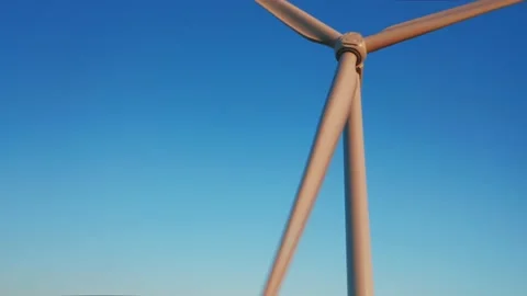 An aerial view of a windmill against the blue sky during sunset. Stock Footage 159089941