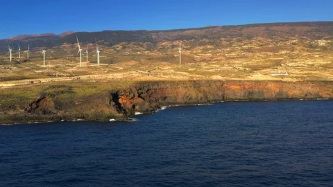 Aerial view of windmill farm at the Atlantic ocean shore on Tenerife Stock Footage 102767912
