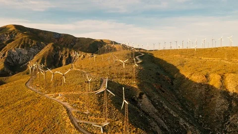 Aerial view of a windmill farm at sunset Stock Footage 105761640
