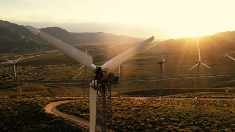 Aerial view of a windmill farm at sunset Stock Footage 105762387