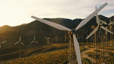 Aerial view of a windmill farm at sunset Stock Footage 105762847